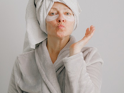 woman-in-gray-bathrobe-pouting