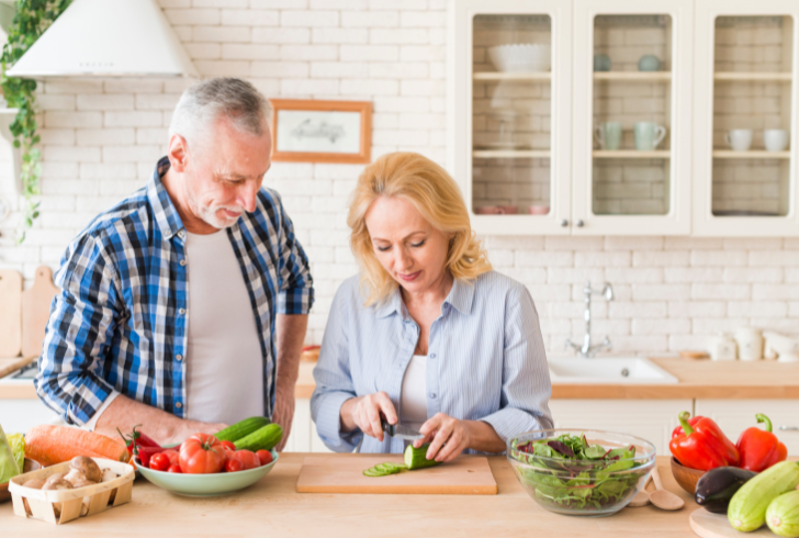 Elderly couple enjoying balanced meal